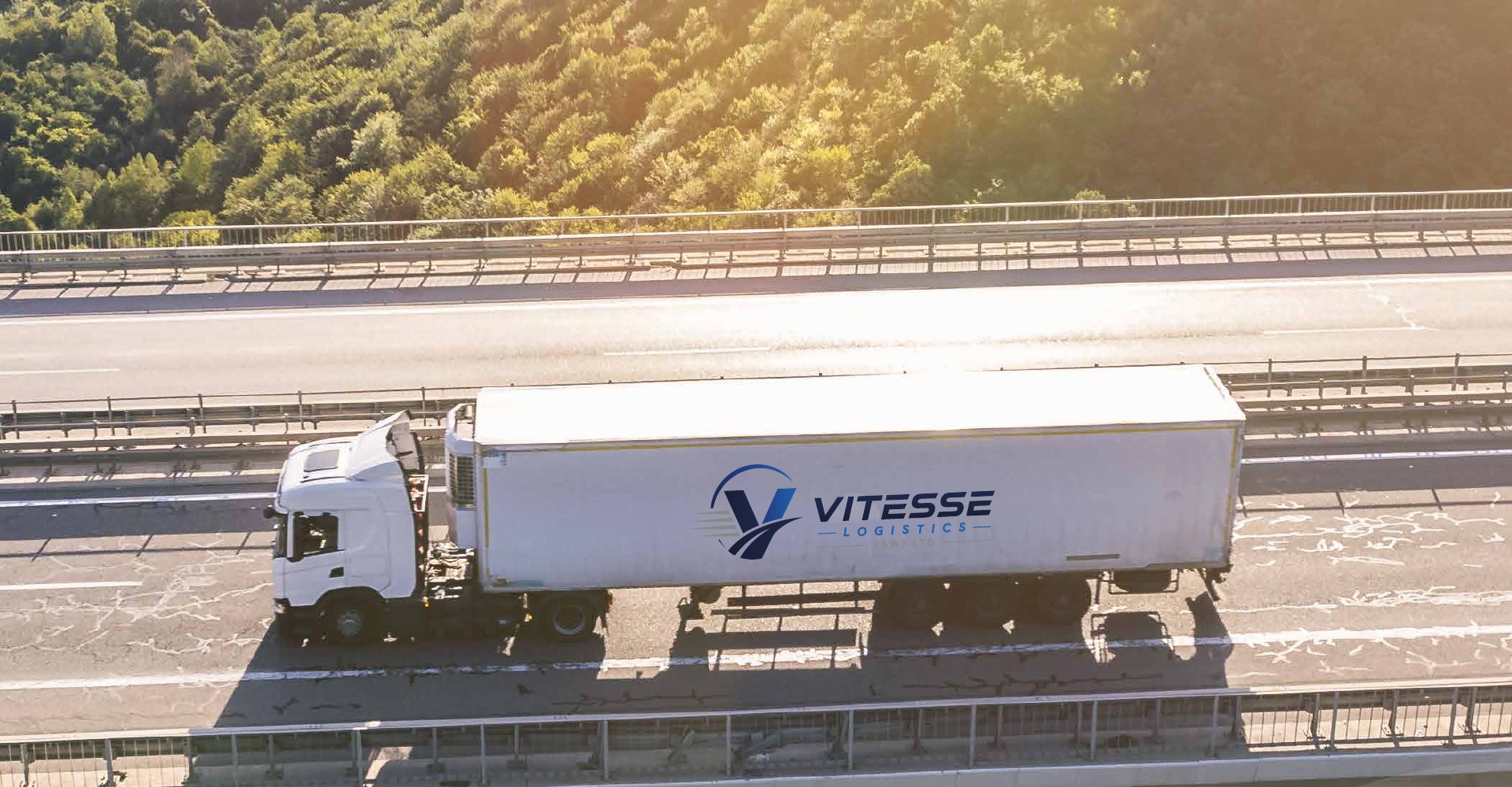 Vitesse Logistics branded truck on the road